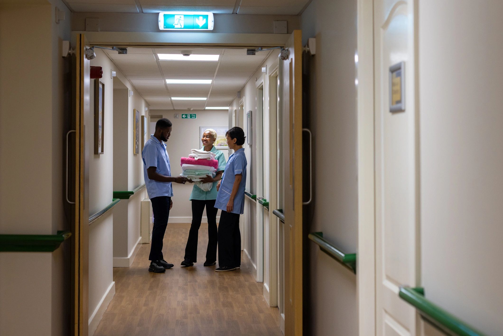 Healthcare professionals talking in a corridor